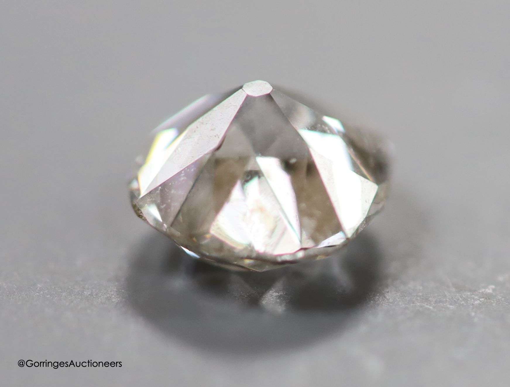 An unmounted cushion cut diamond, weighing approximately 1.10ct